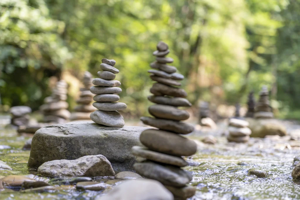 many stone pyramids balanced river water